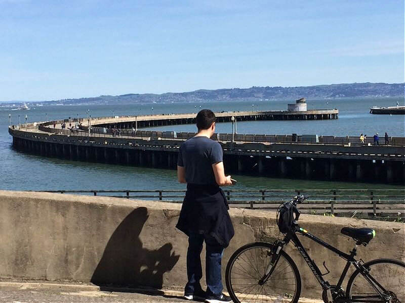 Man looking at Municipal Pier in San Francisco