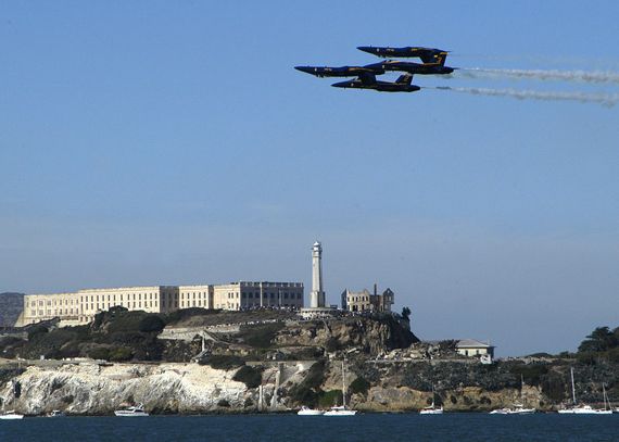 Tight formation of four Blue Angels flying past Alcatraz