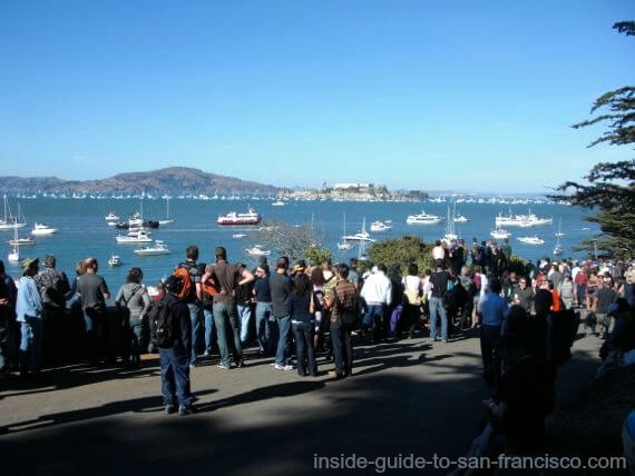 People standing at best view spot for Blue Angels at SF airshow.