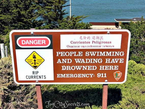 Warning sign for rip currents, China Beach, San Francisco Warning sign for rip currents, China Beach, San Francisco