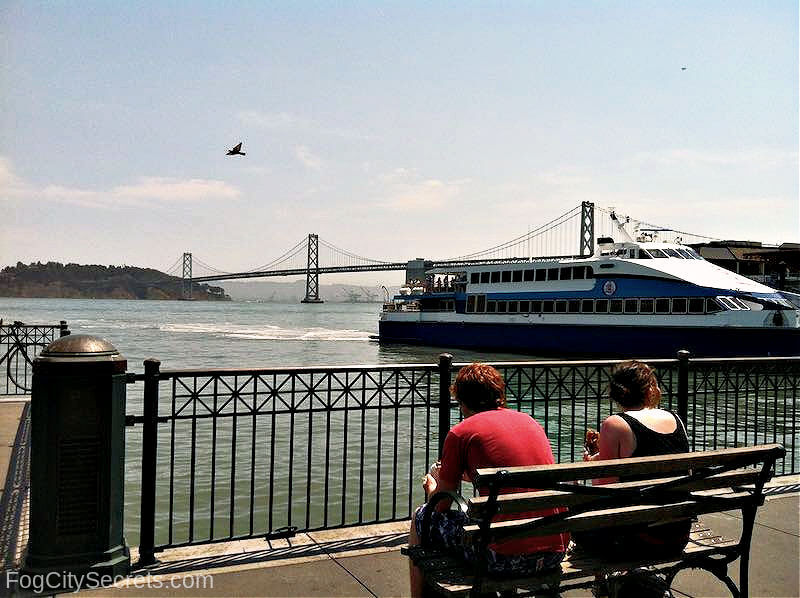 People sitting on a bench SF Embarcadero People sitting on a bench SF Embarcadero