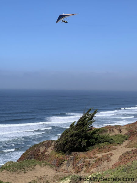 Hang glider in air above Fort Funston Hang glider in air above Fort Funston