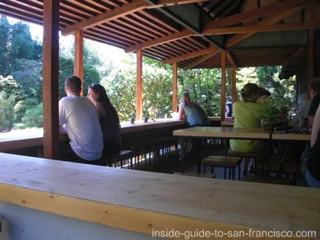 People relaxing at Japanese Tea House counter People relaxing at Japanese Tea House counter