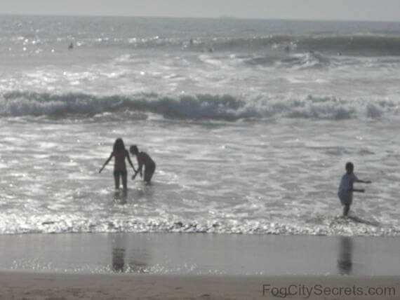 Children playing in water at Ocean Beach San Francisco