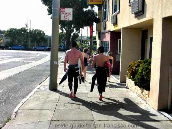 Surfers headed to Ocean Beach San Francisco