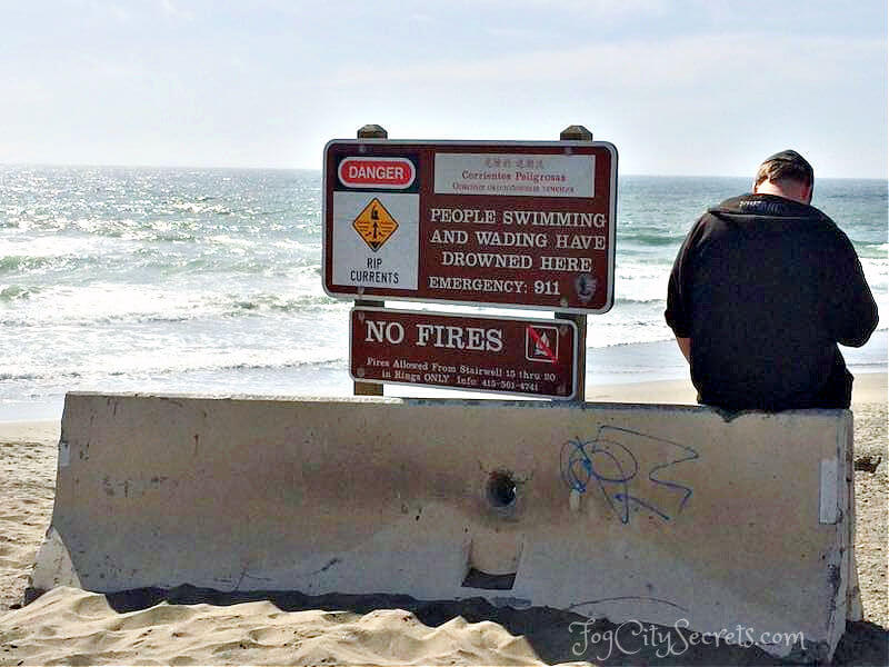 Warning signs at Ocean Beach in SF Warning signs at Ocean Beach in SF