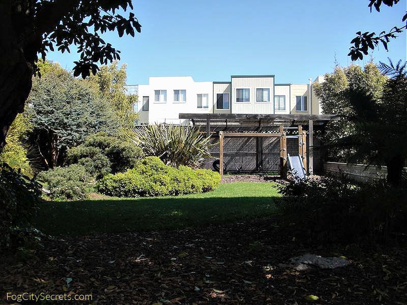 Backyarkd of Ocean Park Motel with children's play structure