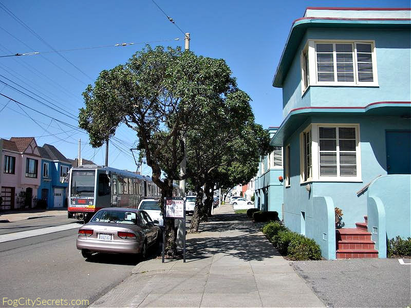 Muni strret car going past the Ocean Park Motel in SF