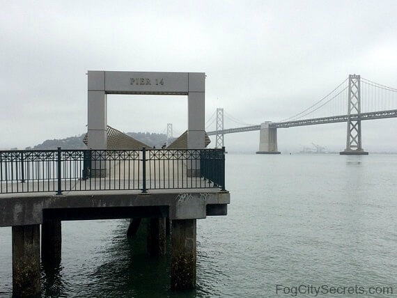 Entrance to Pier 14 and view of the Bay Bridge Entrance to Pier 14 and view of the Bay Bridge