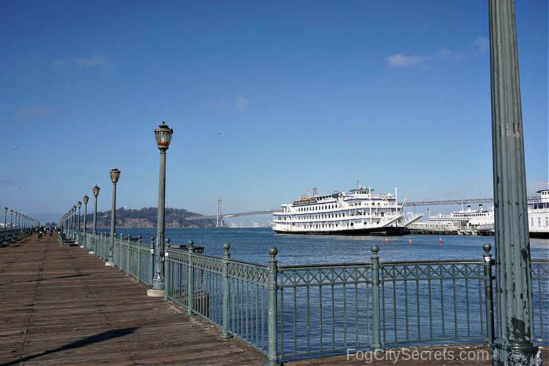 Pier 7 on the SF Embarcadero with view of a steamboat and Yerba Buena Island  Pier 7 on the SF Embarcadero with view of a steamboat and Yerba Buena Island