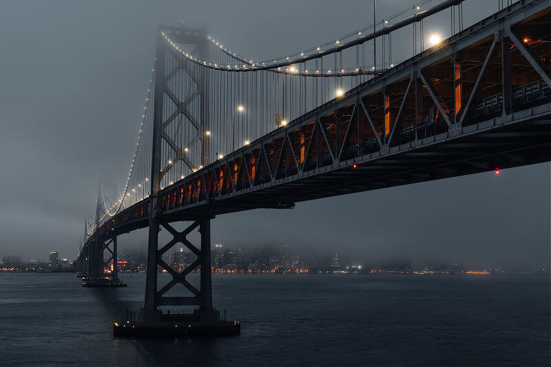 San Francisco Oakland Bay Bridge on foggy evening San Francisco Oakland Bay Bridge on foggy evening