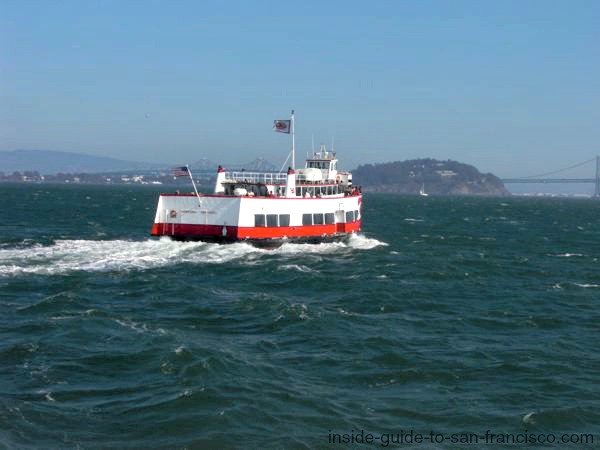 Red and white Ferry crossing San Francisco Bay