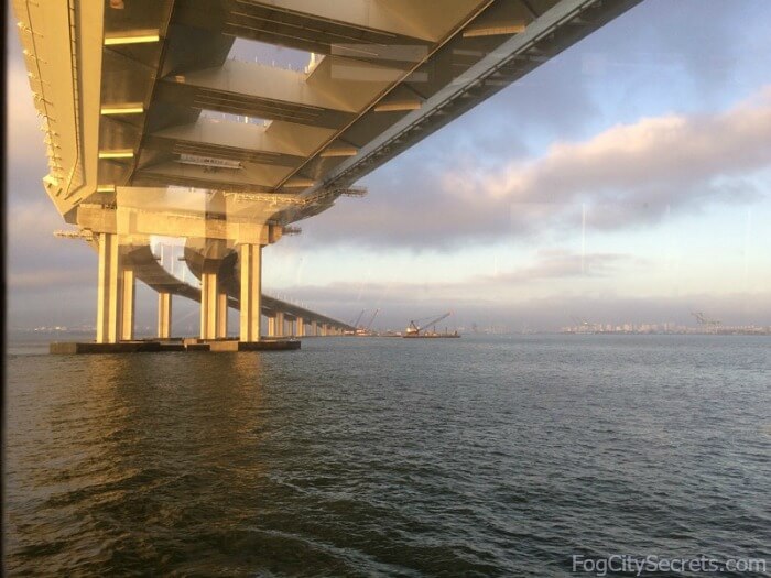 Sun setting while sailing under eastern span of SF Bay Bridge, on Hornblower dinner cruise.