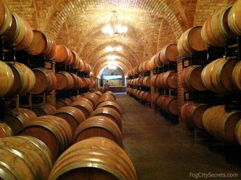 Wine barrels in cave uner the Castello di Amorosa winery