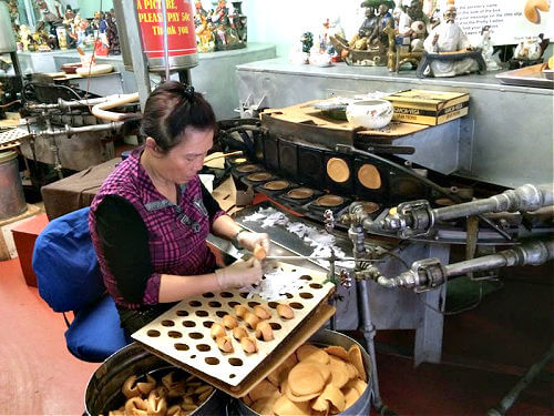 Chinese woman making fortune cookies San Francisco