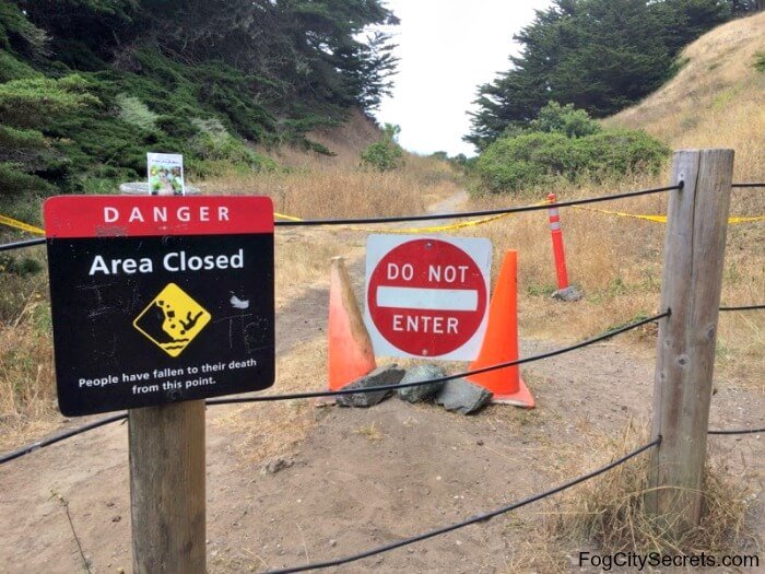 Entry to dangerous path at Lands End, with warning sign