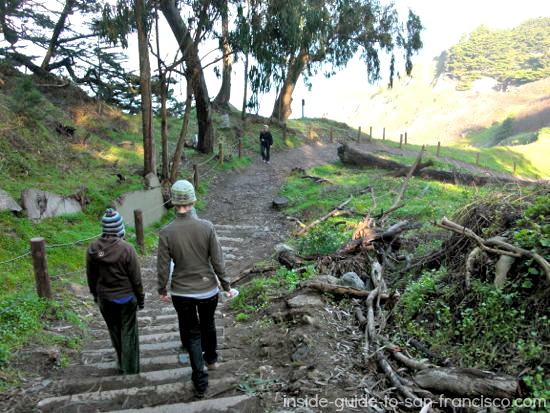 Two women going down hill on Lands End trail